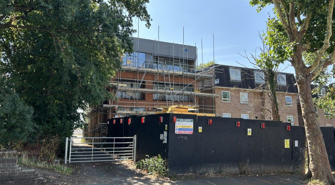 Freehold four-storey building under construction with scaffolding